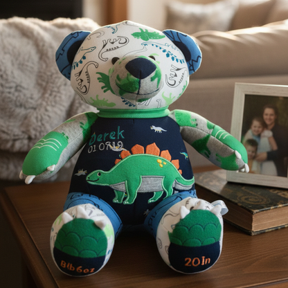 Plush toy bear with dinosaur design on a wooden surface in a home setting